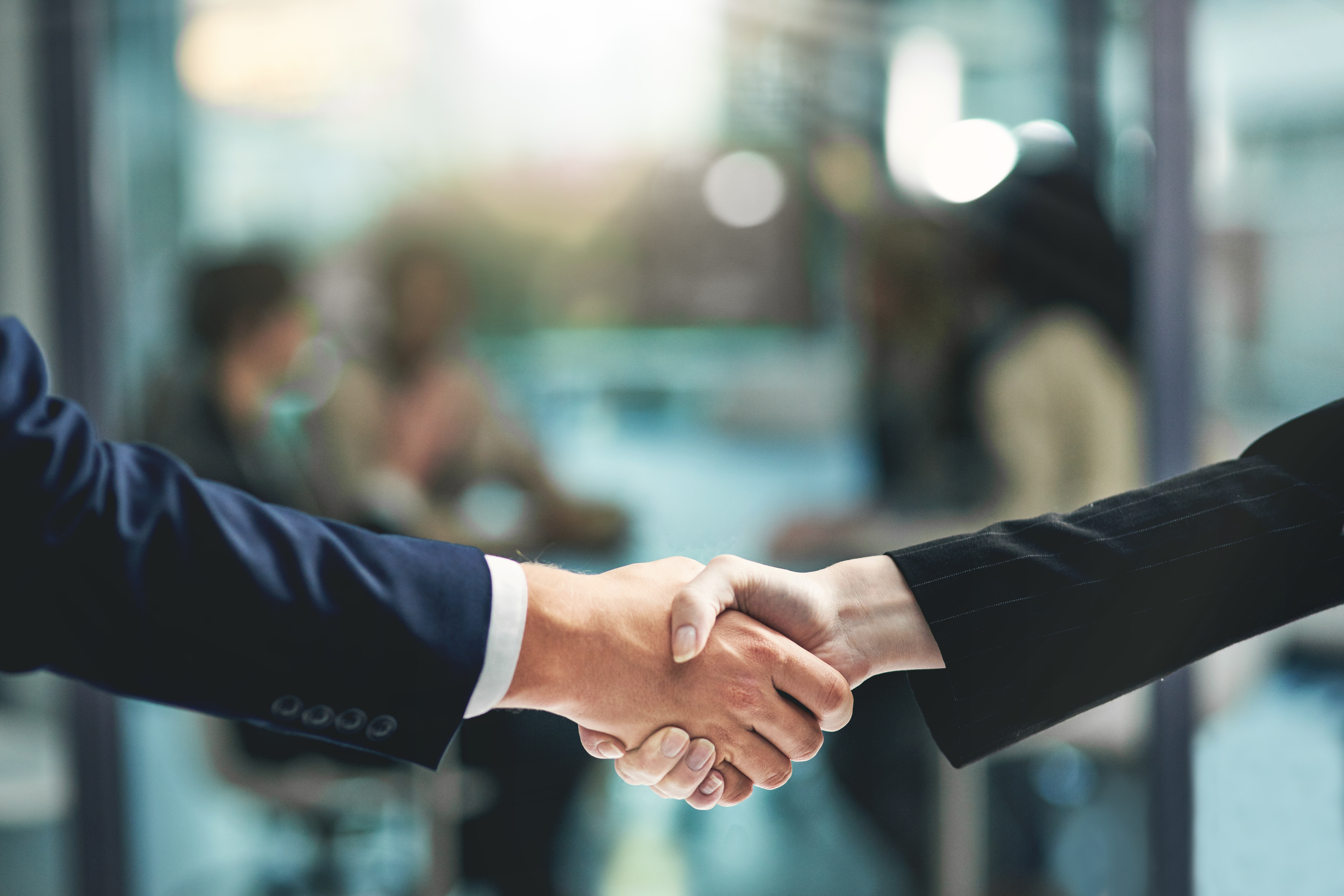 Excelling together. Shot of businesspeople shaking hands.